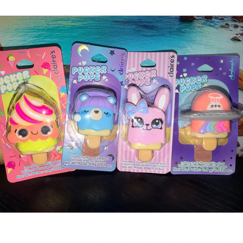 Claire's Pucker Pops Lip Gloss 4 Pack Peach Blueberry Strawberry Cotton Candy